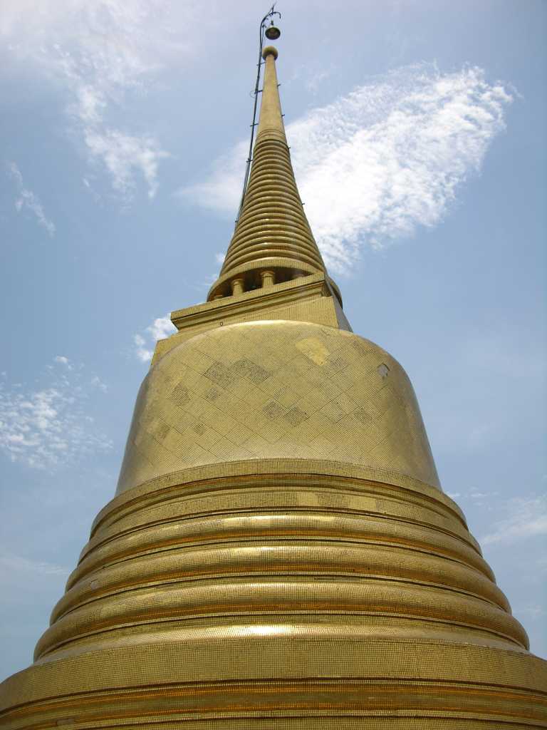Bangkok 02 08 Wat Saket Golden Mount Chedi Wat Saket (The Golden Mount) is an artificial 100m hill, topped by a golden chedi. Rama V built the golden chedi to house a relic of Buddha, which sits atop the chedi. It was found at the ancient town of Kapilavastu in 1898, and presented to the King by the then British Raj government of India. The inscription was believed to be dated back to the pre-Asokan period.